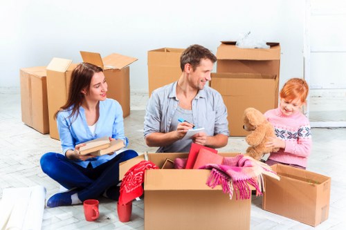 House removalists carrying furniture through a local property