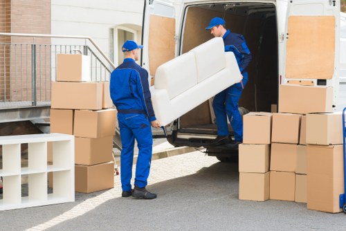Furniture and boxes being loaded for a house removal in Hither Green