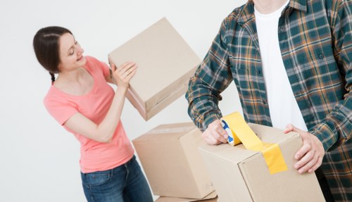 Staff checking access and handling items during a move