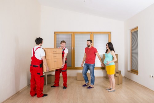 Unpacking household items into a tidy room after moving in Hither Green