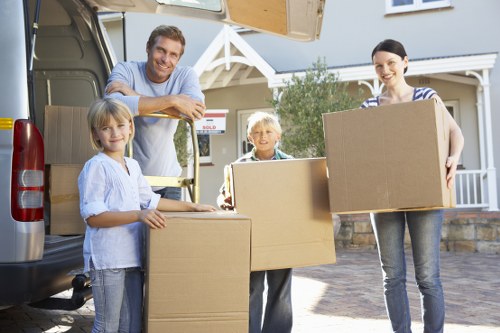 Local removals crew loading boxes and furniture safely