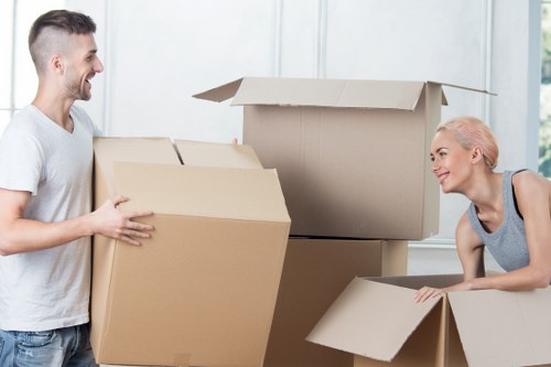 Mover wearing PPE while loading furniture securely