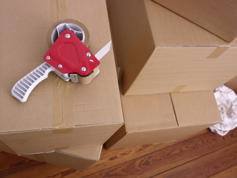 Packed moving boxes and furniture ready for local removal service