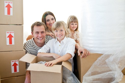 Loading furniture and boxes into a removals van in Hither Green